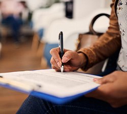 Patient filling out forms in lobby