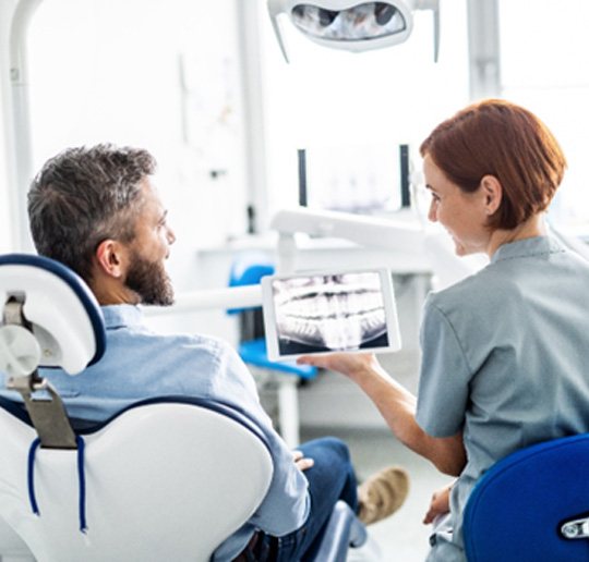 A man consulting his dentist during a checkup