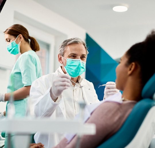 A dentist about to perform a dental checkup