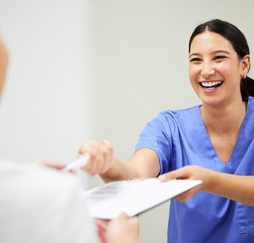 Patient in Gahanna discussing clear aligner costs with dental team member