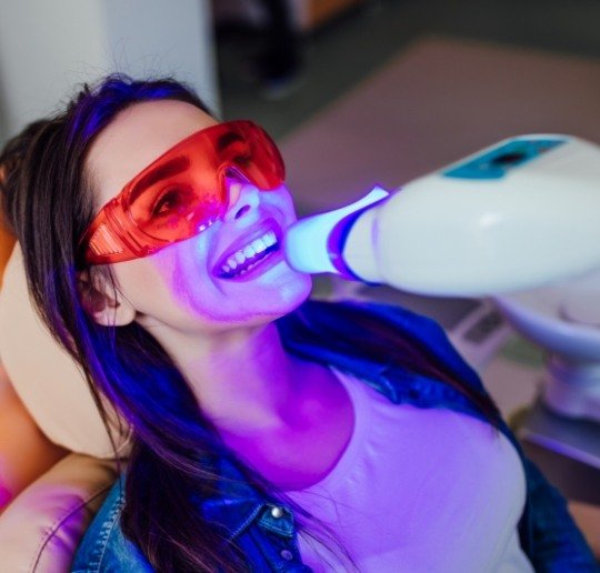 Patient receiving teeth whitening