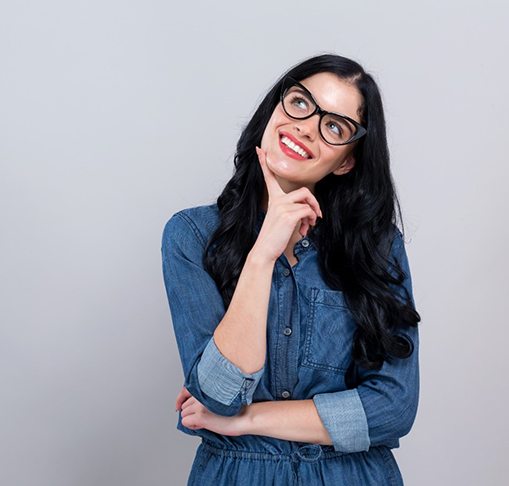 woman smiling and thinking about dental crowns in Gahanna