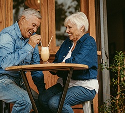 Senior couple sharing a milkshake