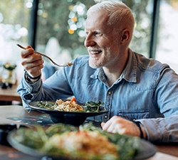 Man eating a chicken salad