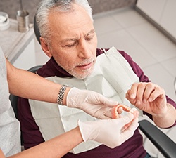 Man at the dentist getting dentures