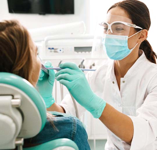 Emergency dentist in Gahanna performing an exam