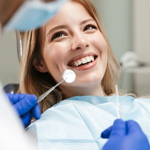 young woman smiling while visiting emergency dentist in Gahanna