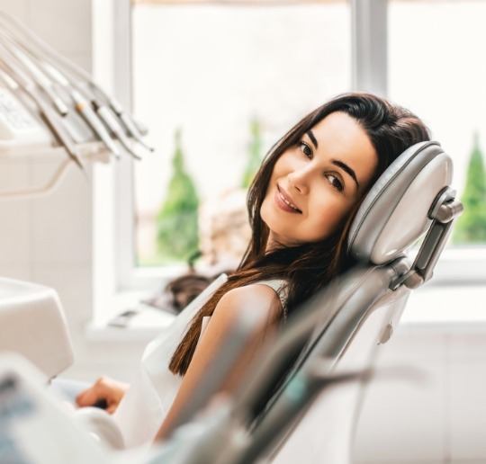 Smiling woman in dental chair