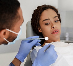 Woman afraid in the dental chair