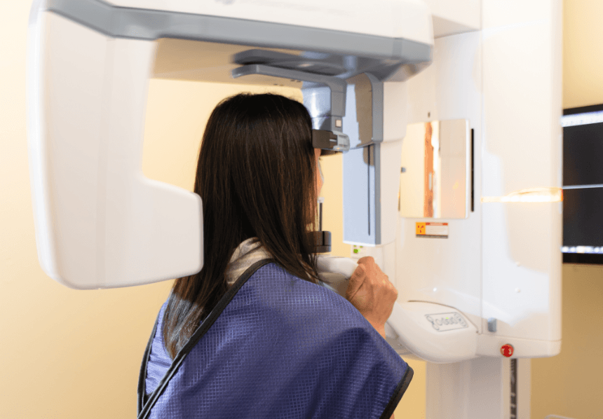 Patient receiving 3 D C T cone beam x-ray scans