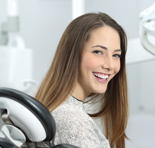 Woman smiling during preventive dentistry checkup and teeth cleaning