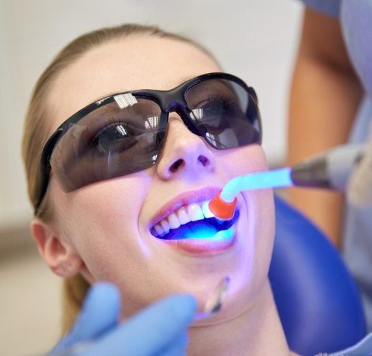 Woman receiving dental sealants