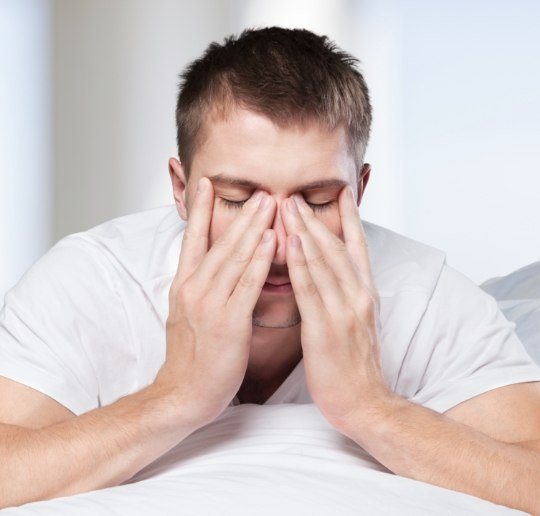 Man waking tired before sleep apnea therapy
