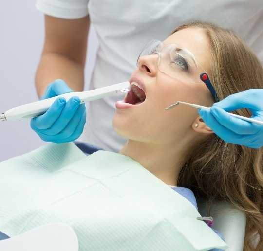 Dentist capturing smile photos with intraoral camera