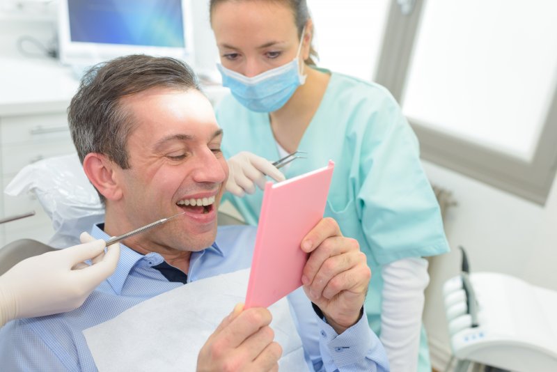 Patient being fitted for dental crowns