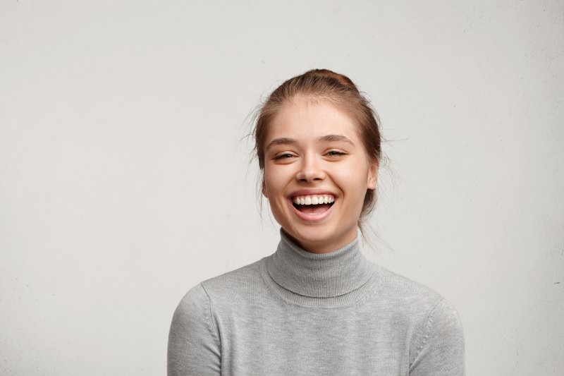 Young adult flashing a white smile