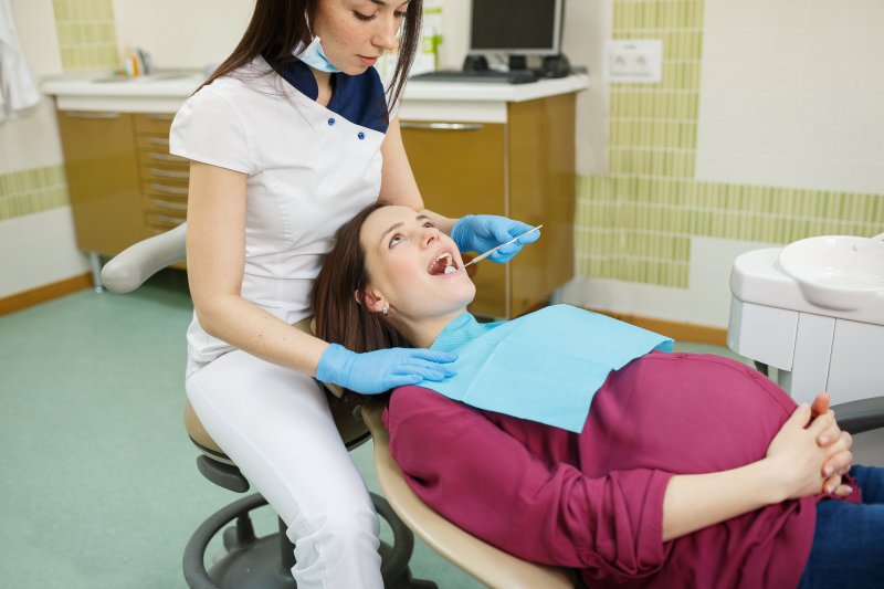 A dentist treating a pregnant patient