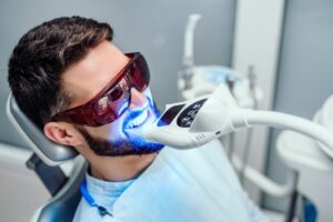 Man having teeth professionally whitened. 